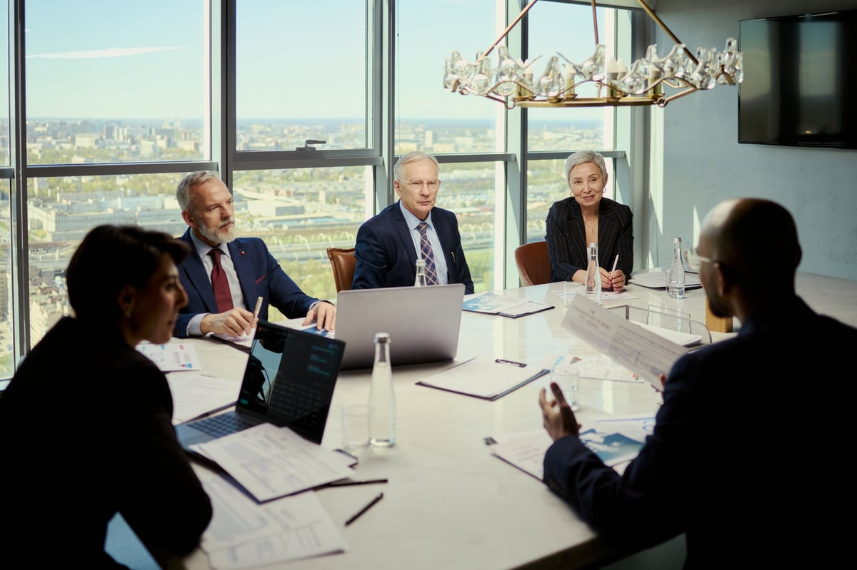 Executive boardroom meeting with business team